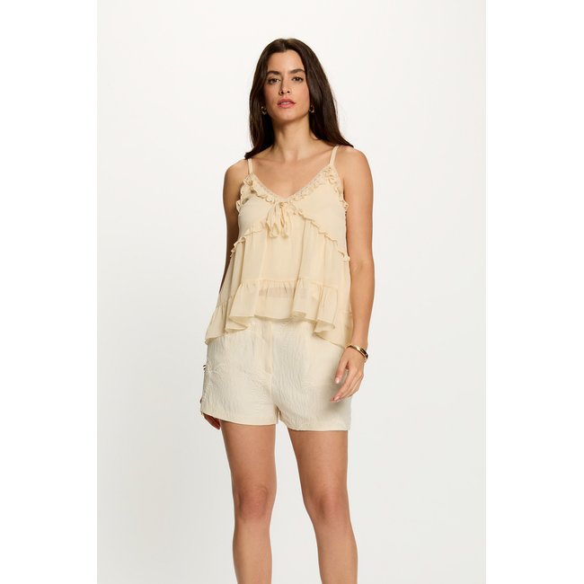 Top ajusté avec détails creme <span itemprop=