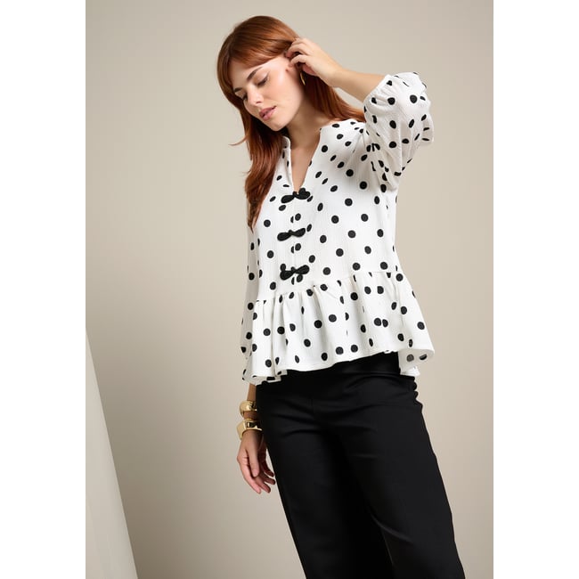Top péplum à pois blanc casse <span itemprop=