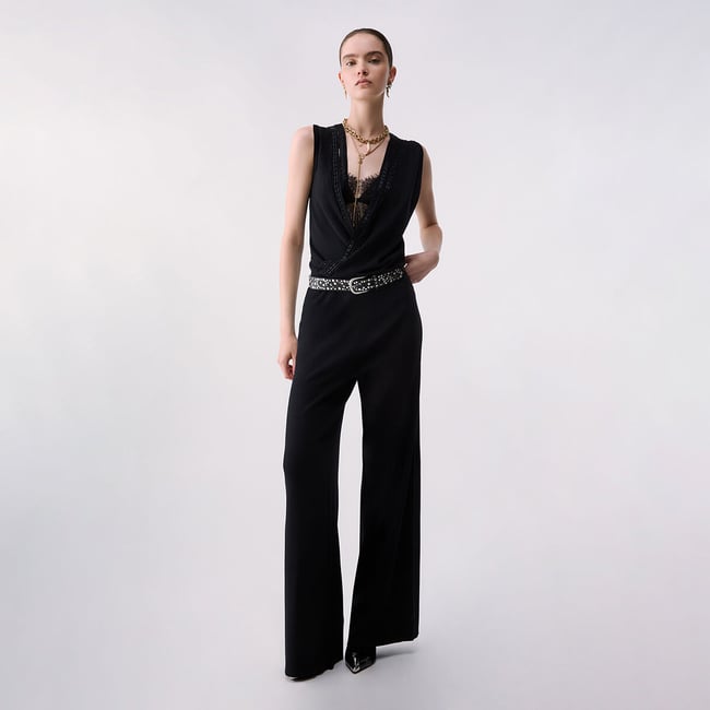 Combinaison longue en maille noir <span itemprop=