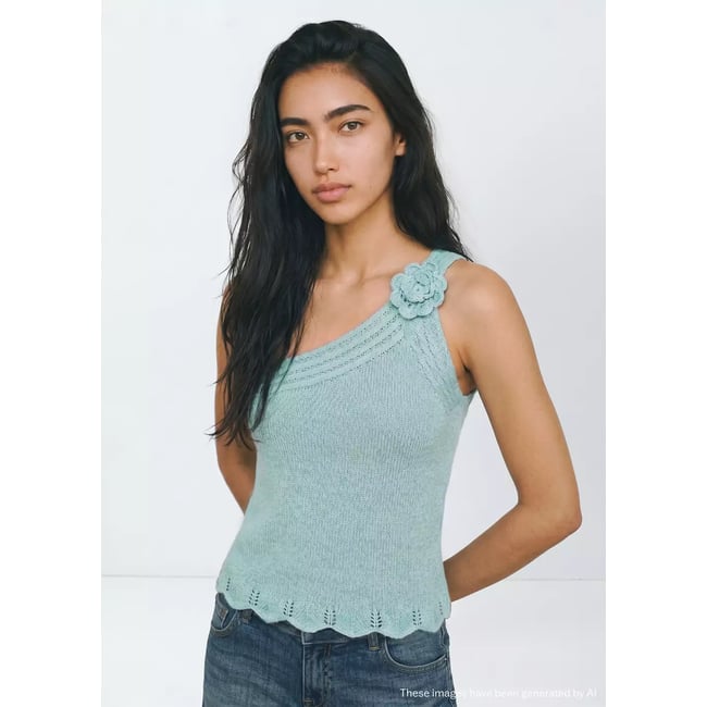 Top asymétrique en maille ajourée bleu <span itemprop=