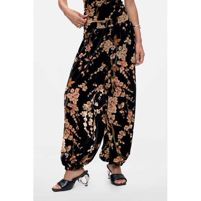 Pantalon ballon à fleurs en velours noir <span itemprop=