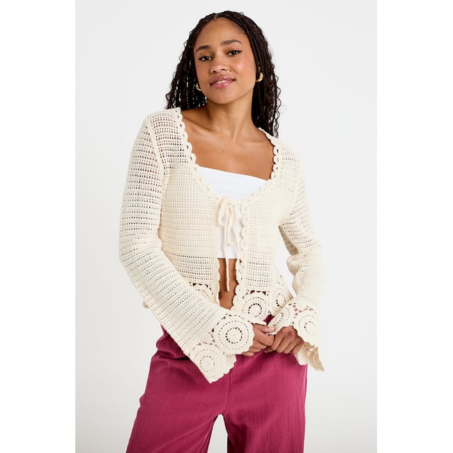 Gilet col v manches longues avec noeuds ecru <span itemprop=