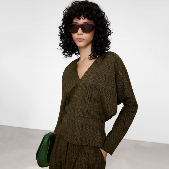 Sommet à damier en péplum vert à carreaux <span itemprop=