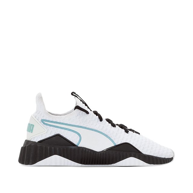 puma defy sneakers in white