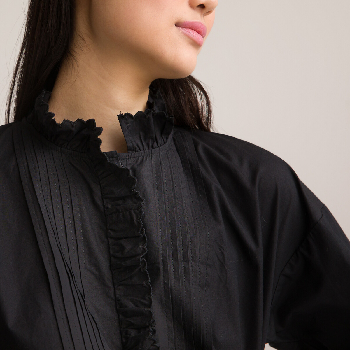 black shirt with ruffle sleeves