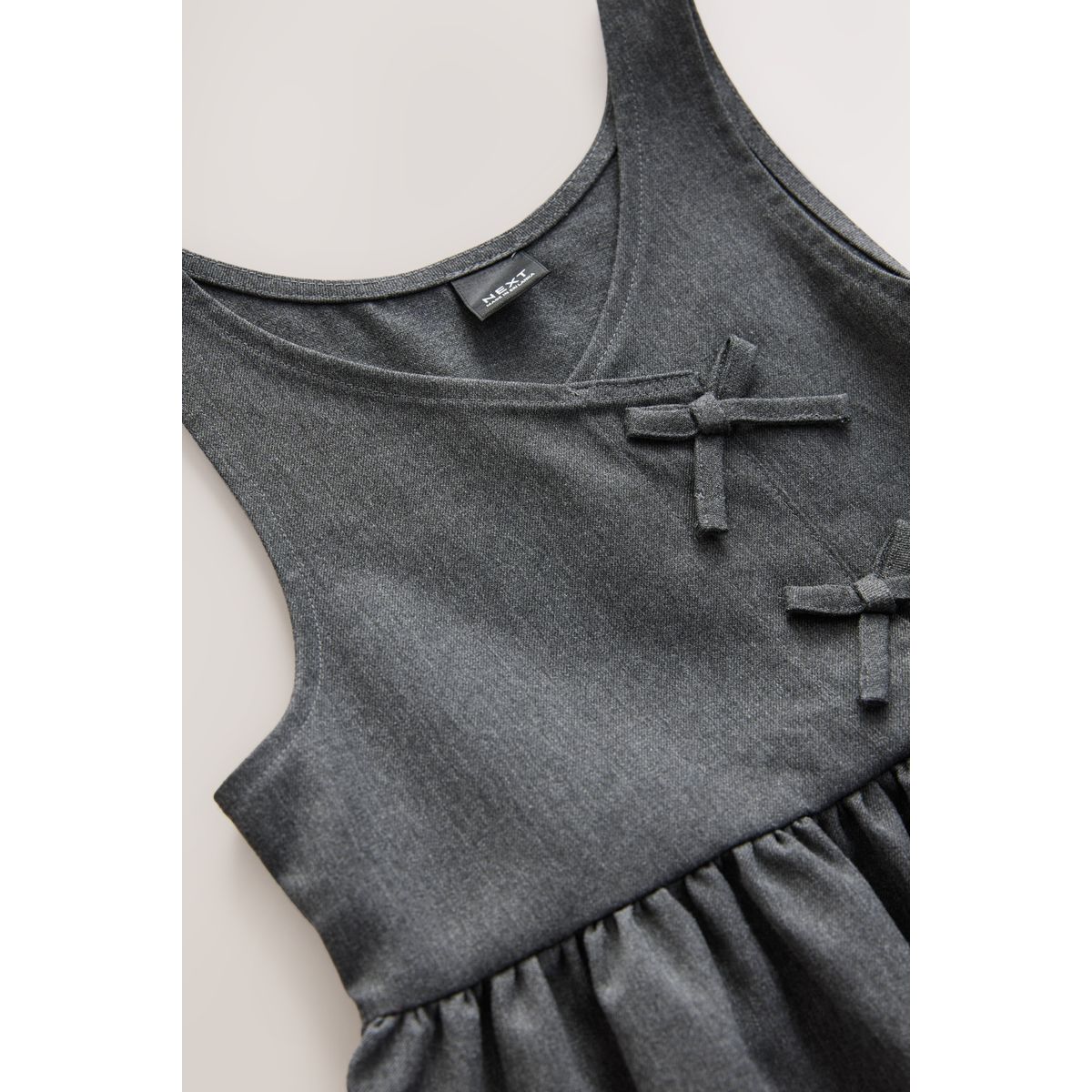 Robe chasuble d’école asymétrique avec nœud, NEXT