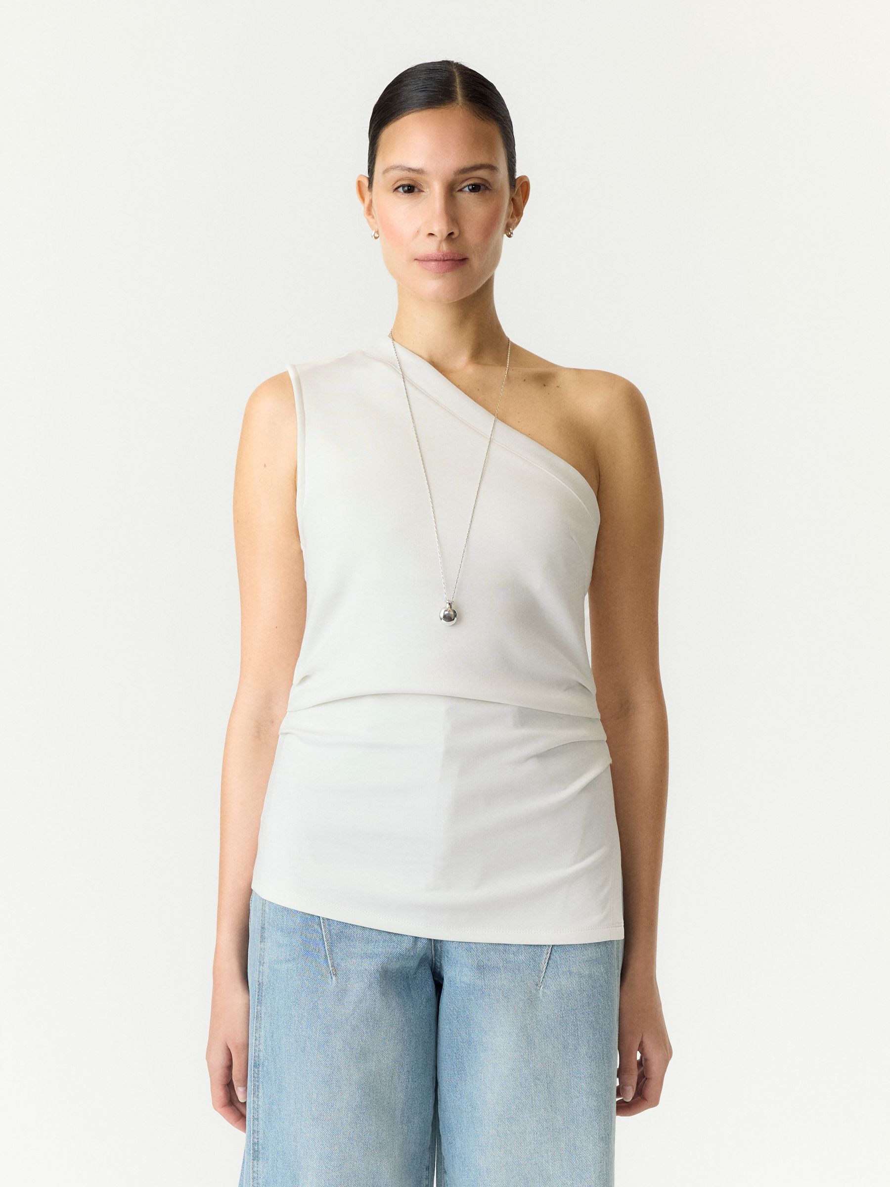 Haut Asymétrique, YAS