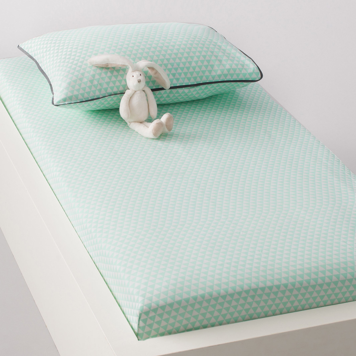 pillow under fitted sheet for baby