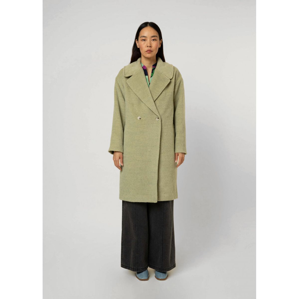 Manteau vert cintré sale